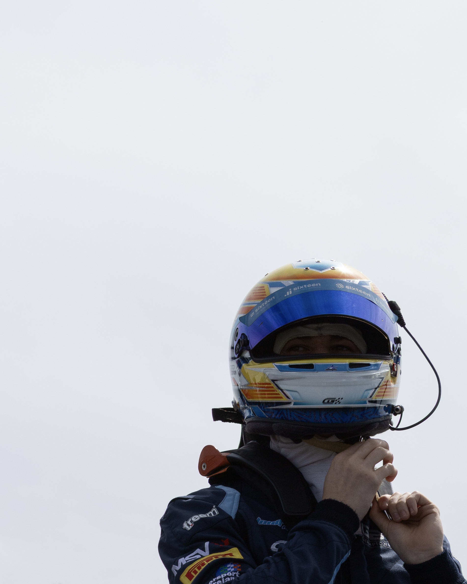 Conor Grant fastening his helmet at Donington in 2026